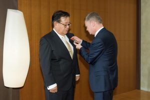 Ambassador of France to Japan, Mr. Laurent Pic, awarding medal to Professor Murai
